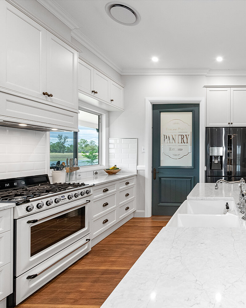 Large farmhouse-style kitchen in rural home built by Luke Keune Builders